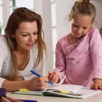 mother with daughter doing homework
