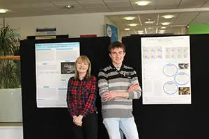 Students in front of a poster presentation. 