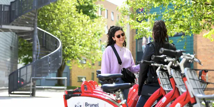 Two students talking on campus
