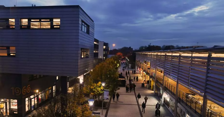Night view of Brunel University campus concourse