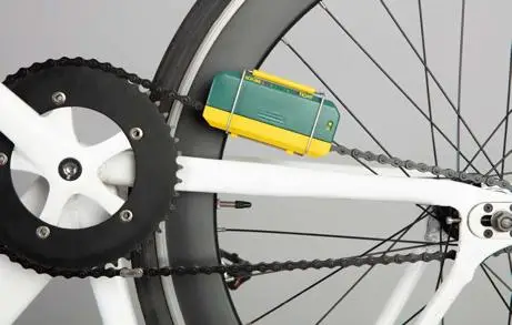 Back wheel of bike with wooden block tool attached