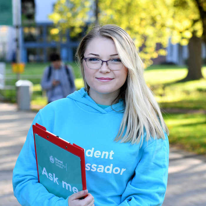 female student ambassador with a clipboard
