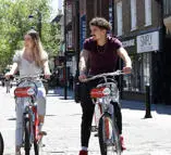 students on bikes in Uxbridge High Street