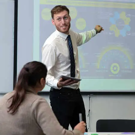 trainer infront of interactive board