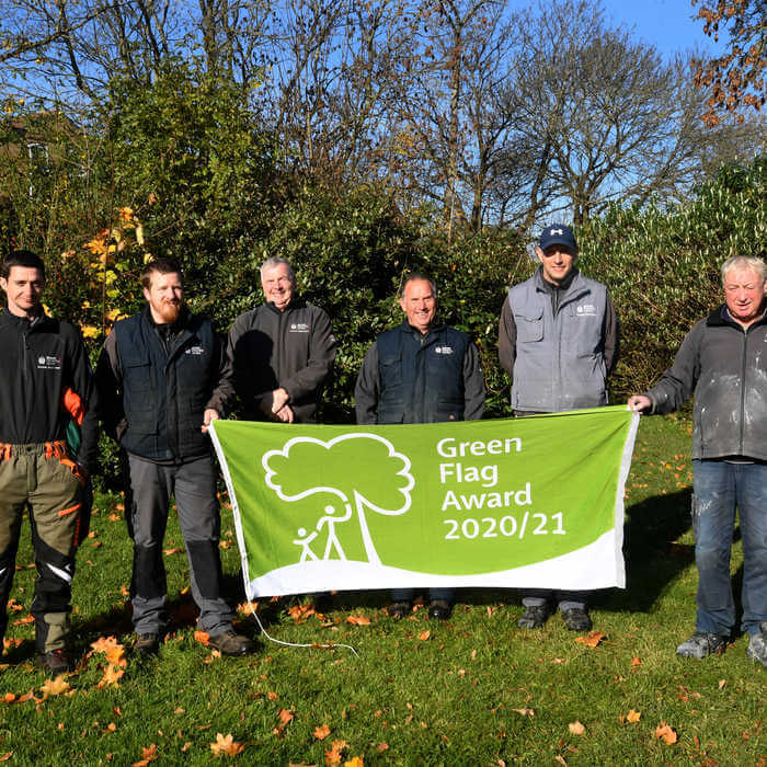 Brunel Grounds Team with a Green Flag Award flag