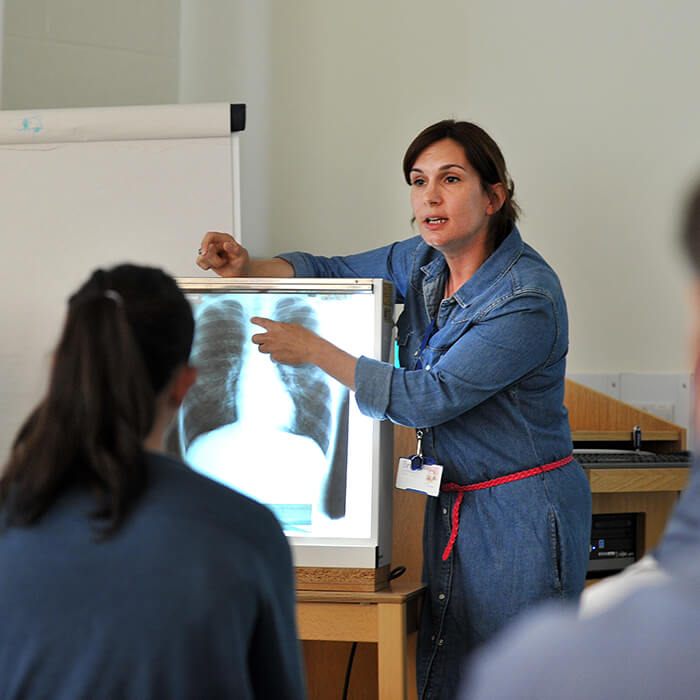 physiotherapy lecturer explaining upper body xray