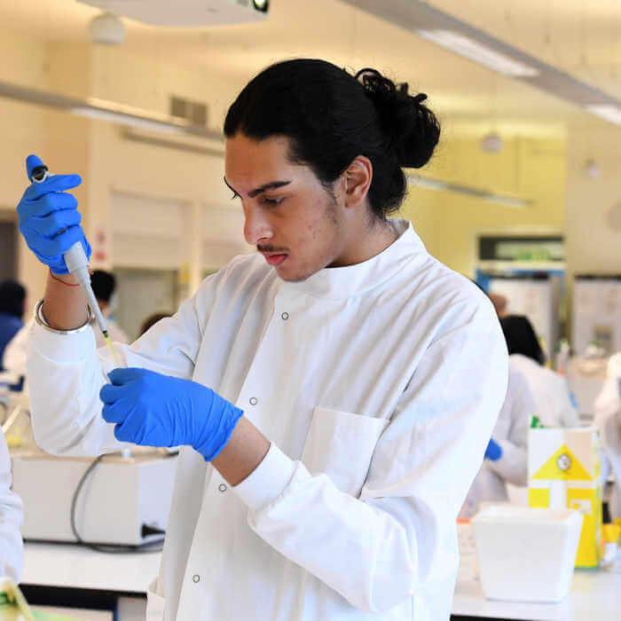 male biomedical science student in lab