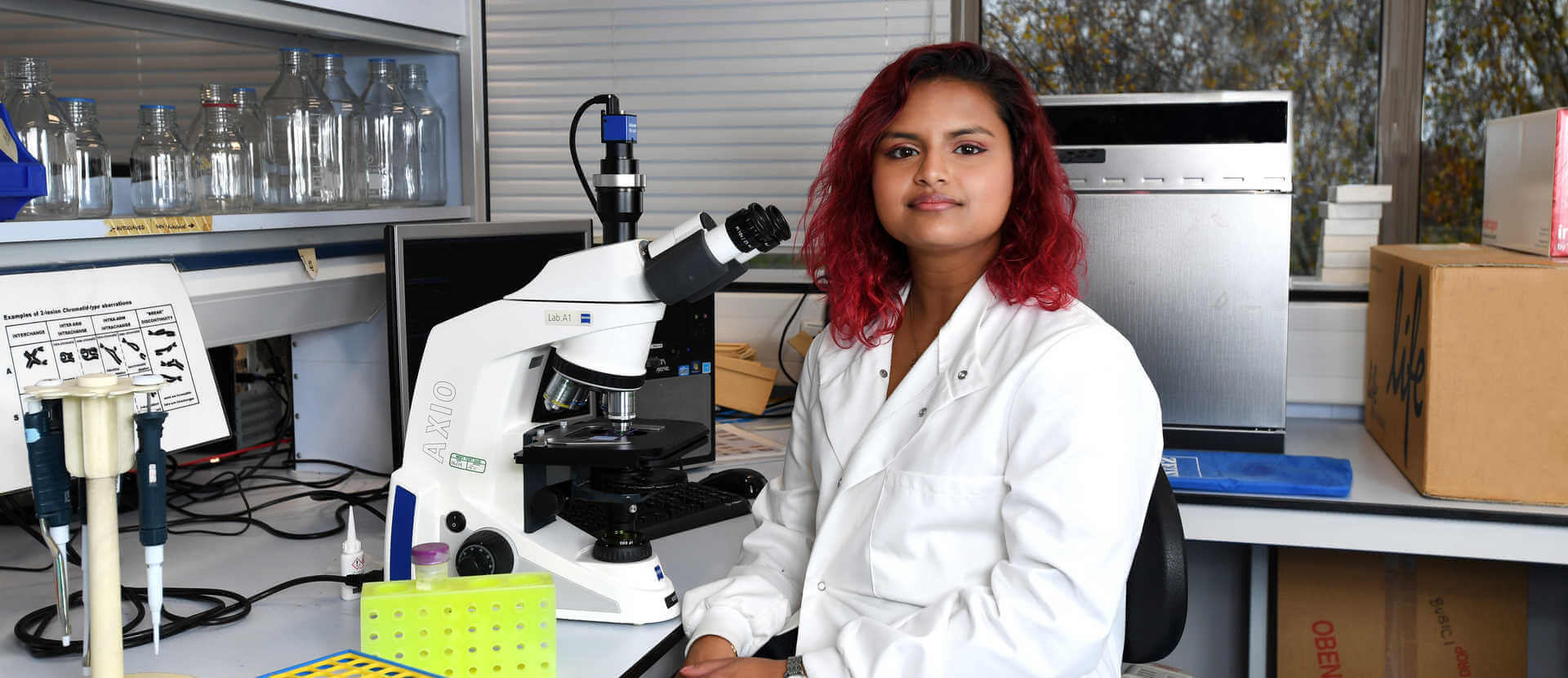 female biomedical sciences student in the biosciences lab 2