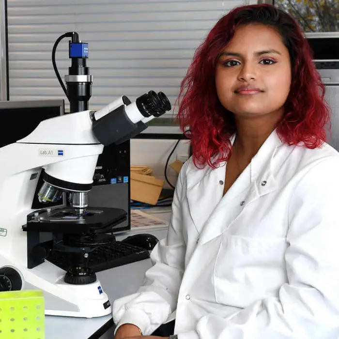 female biomedical sciences student in the biosciences lab 2