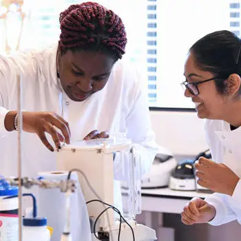 two female biomedical sciences students in lab