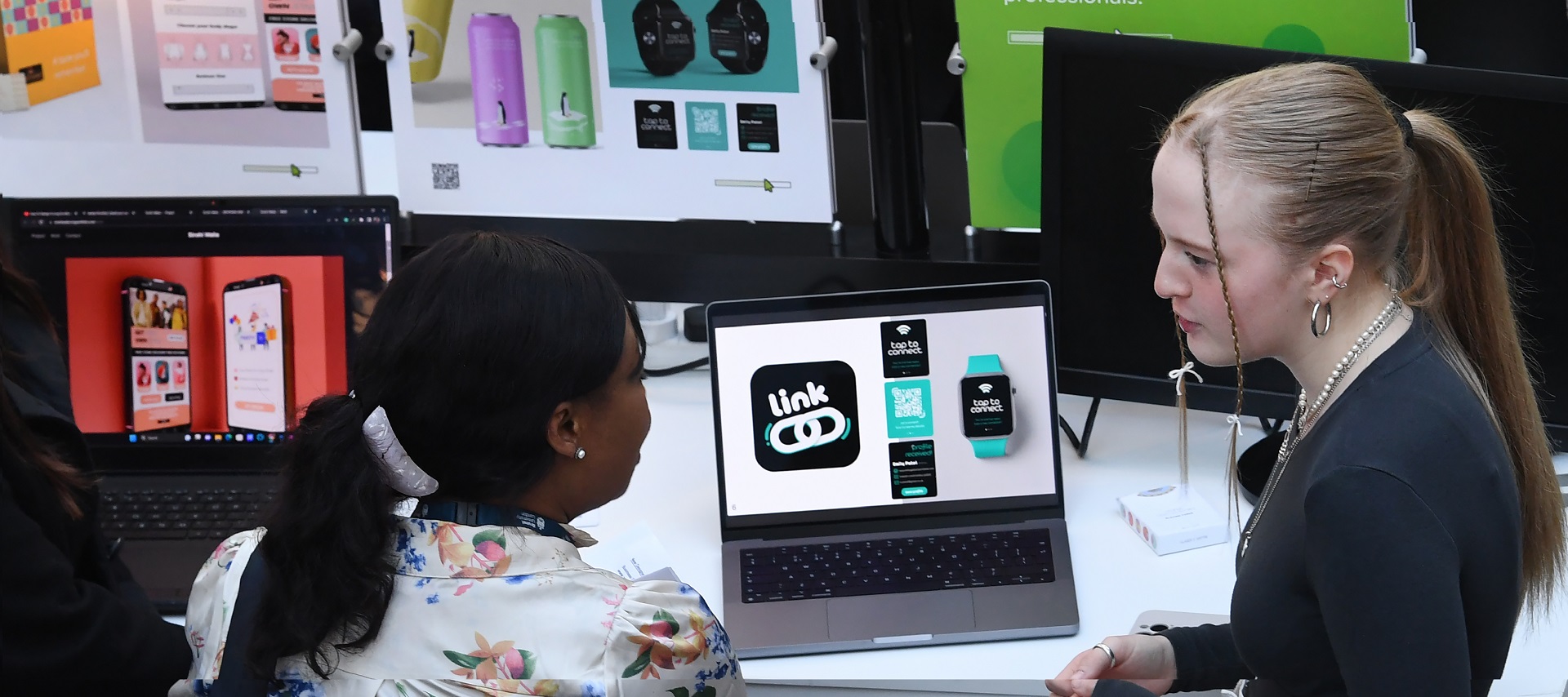 two-design-students-looking-at-design-work-on-laptop-banner