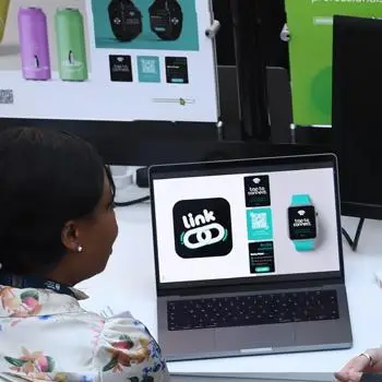 two-design-students-looking-at-design-work-on-laptop-banner