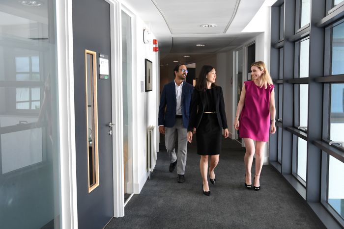 MBA Photographs  - People walking through corridoor
