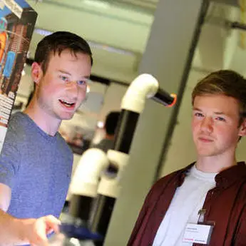 Two students looking at a Design research project