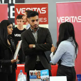 Students discussing Economics and Finance careers during a career's fair
