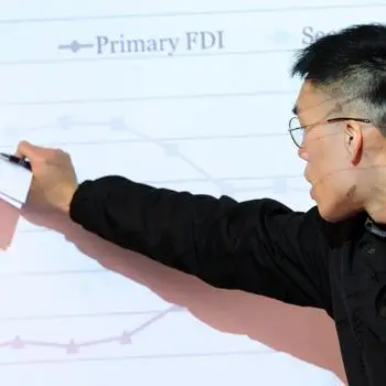 Student on drawing on a board