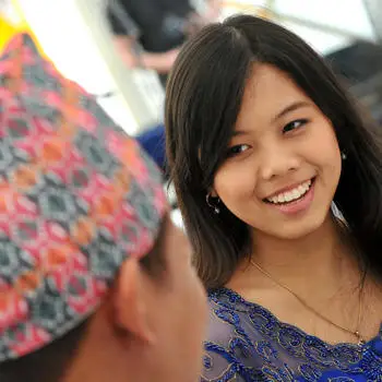 female student talking to locals abroad