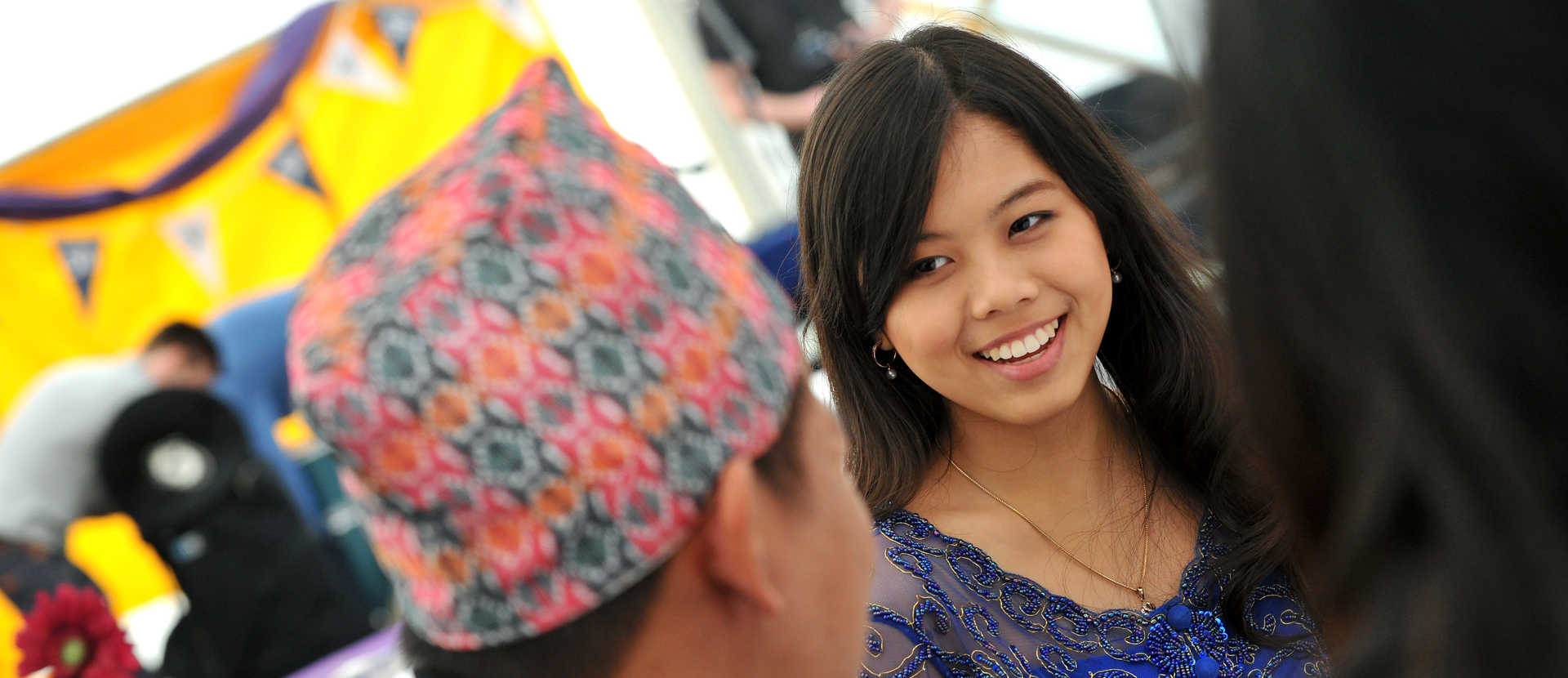 female student talking to locals abroad