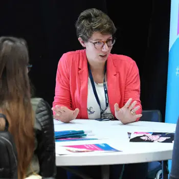 expert lecturer speaking to students