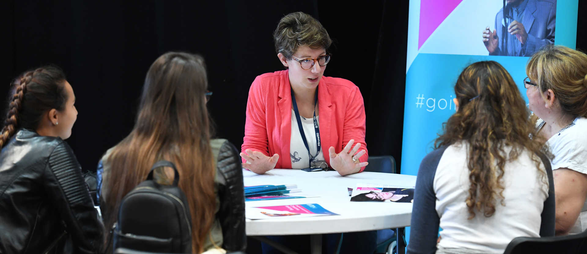 expert lecturer speaking to students