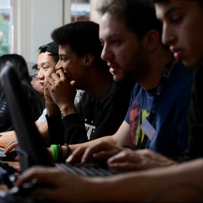 Students using laptops in classroom