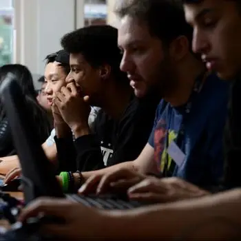 Students using laptops in classroom