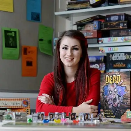 a-female-games-design-student-sitting-amongst-board-games