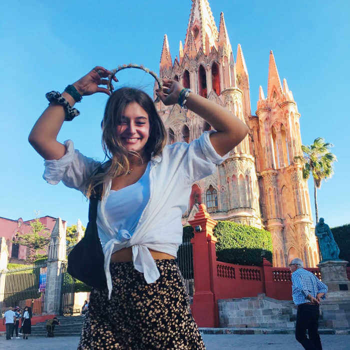 Student standing infront of La Parroquia in Mexico