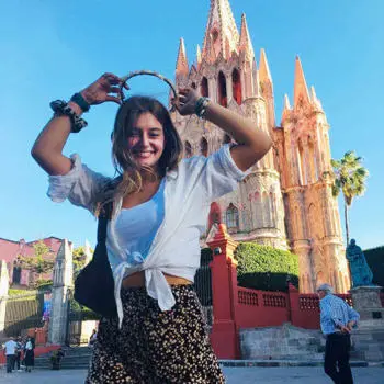 Student standing infront of La Parroquia in Mexico