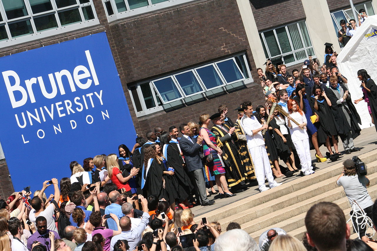 Mark Ronson and Katy B carry Olympic torch through Brunel