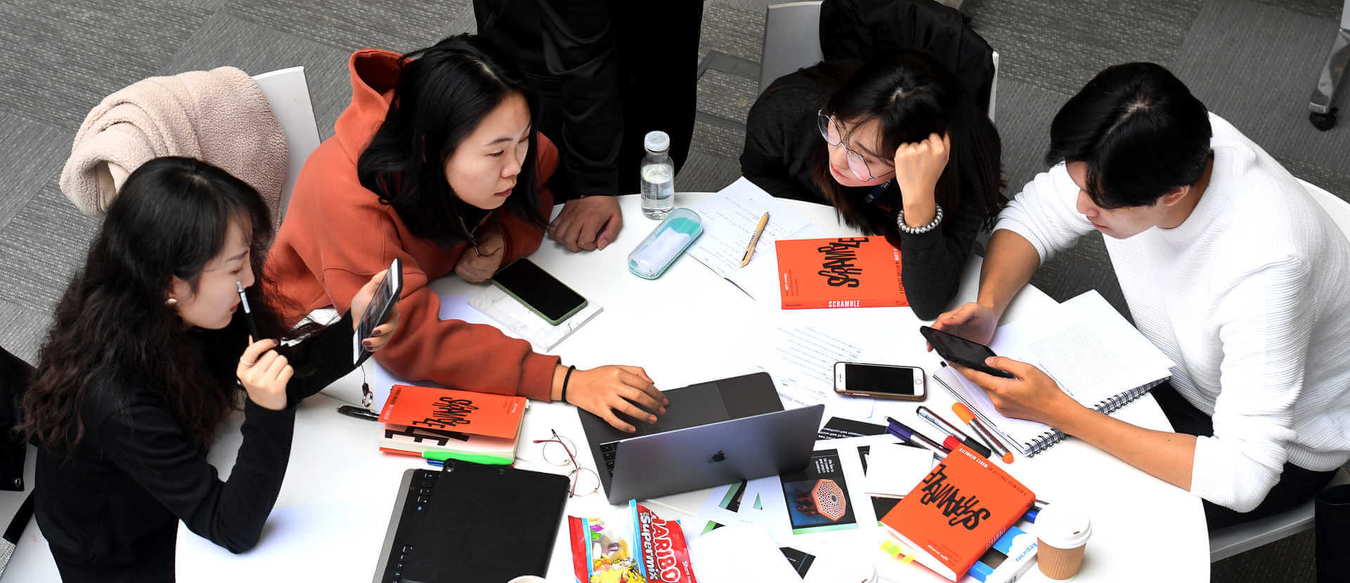 group of students sitting round a table working