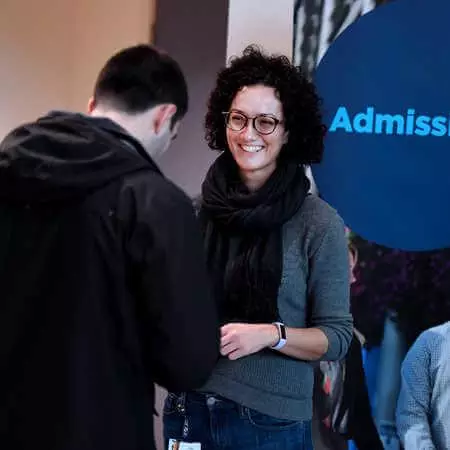 Admissions staff talking to applicant at open day