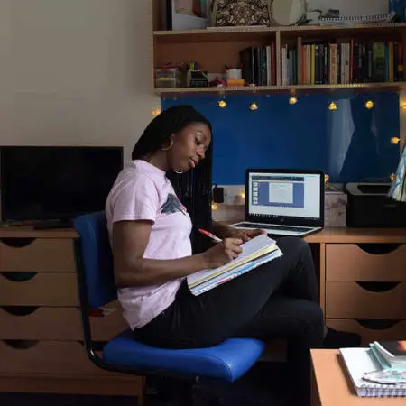 Female student studying in her brunels on campus accommodation