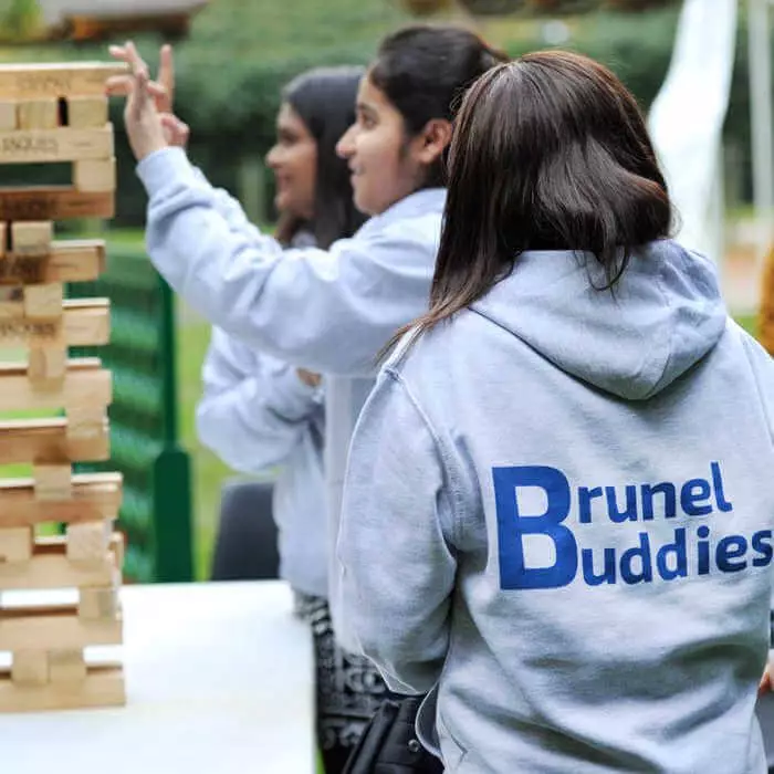 brunel buddies playing jenga with new international students
