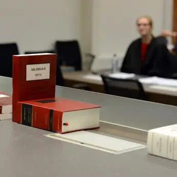 Legal books stacked on the bench in the moot court