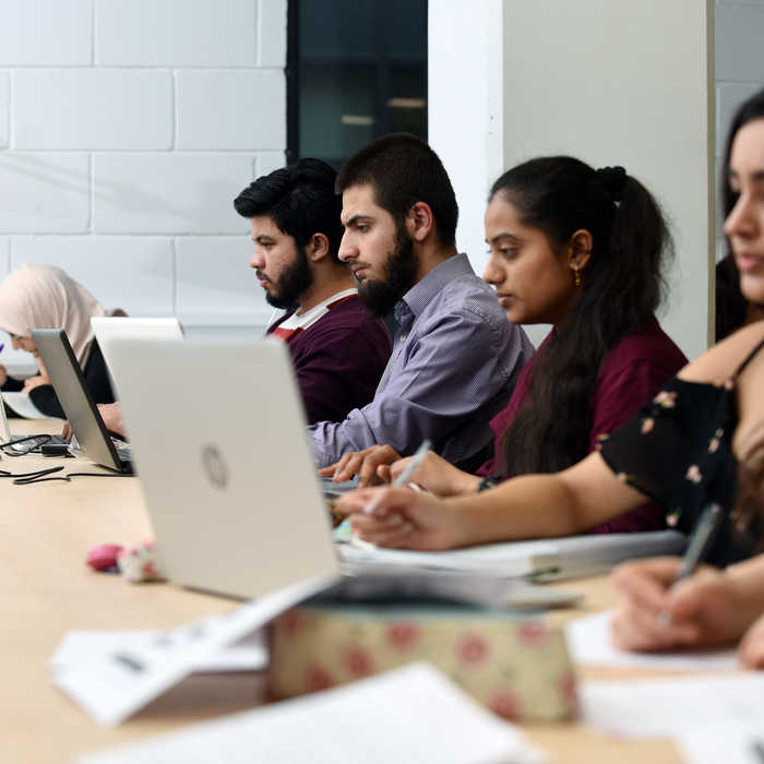 Students studying in a row