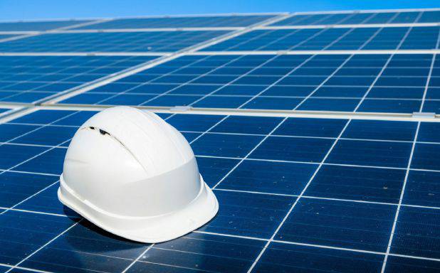 Hardhat on solar panels