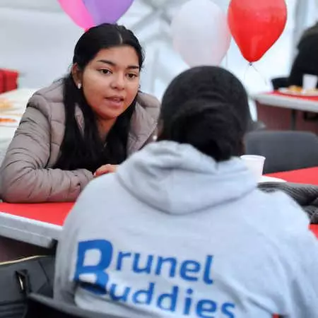 brunel buddie sitting and talking with a new student