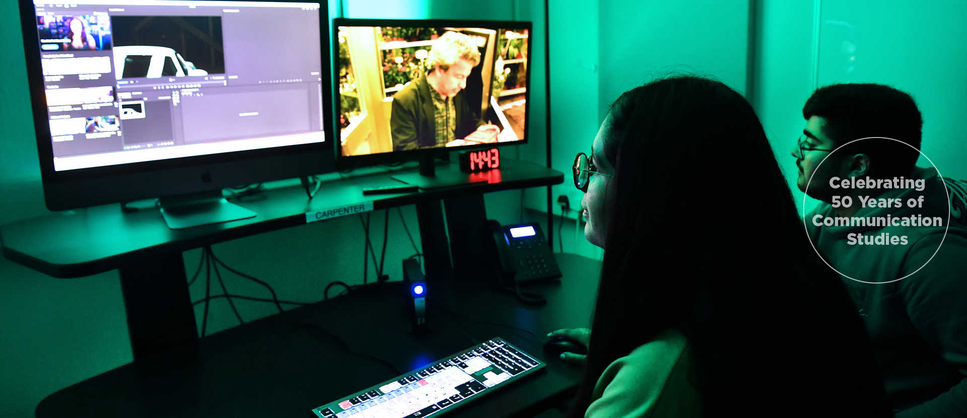 student working with media software