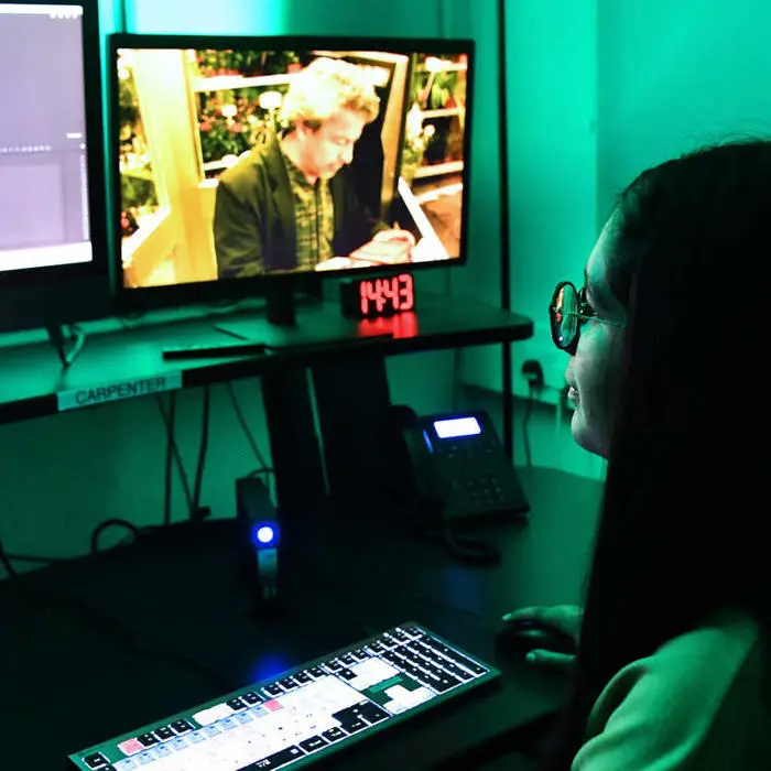 student working with media software