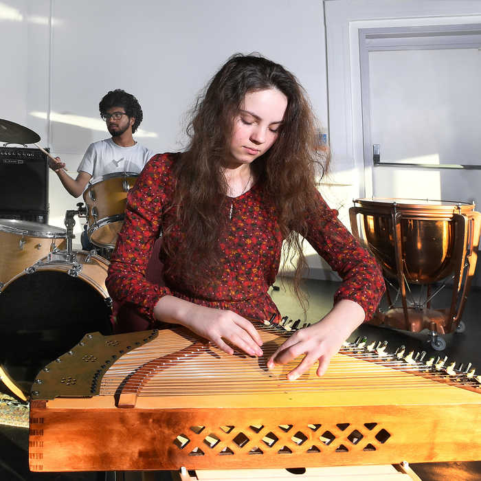 2 students playing instruments