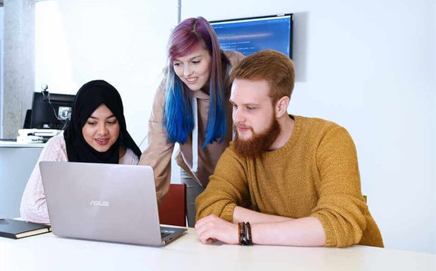 three-students-working-on-a-laptop-Cropped-618x384