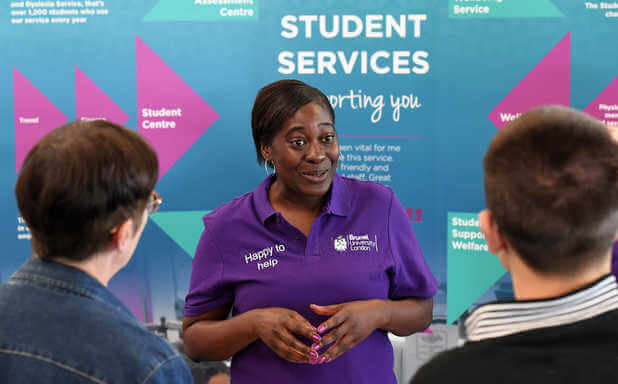 Student Services adviser talking to students