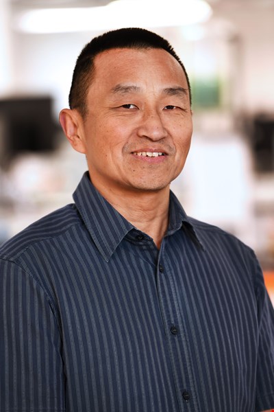 Dr Kun Qi