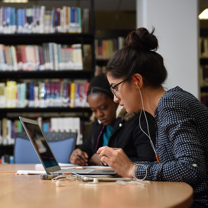 Brunel-psychology-undergraduate-studying-on-laptop-in-library
