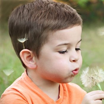 child blowing