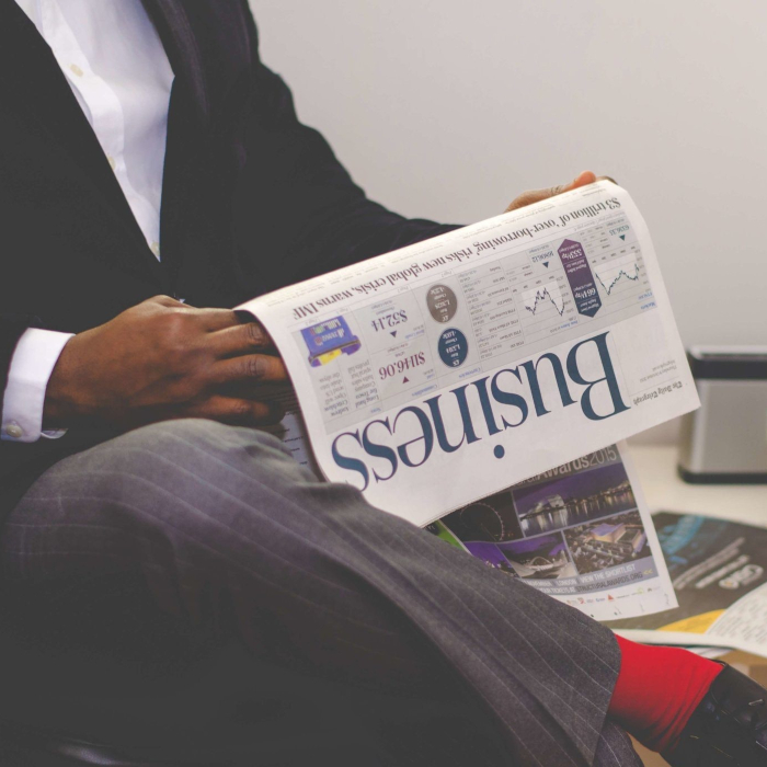 man reading business news