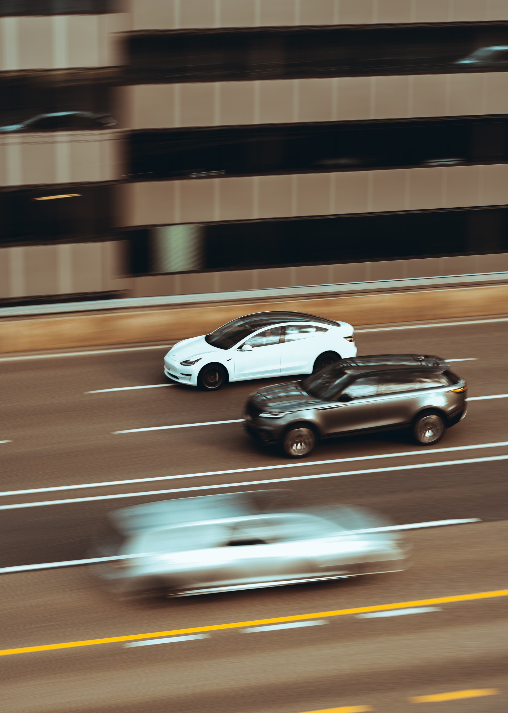 two cars speeding on the road