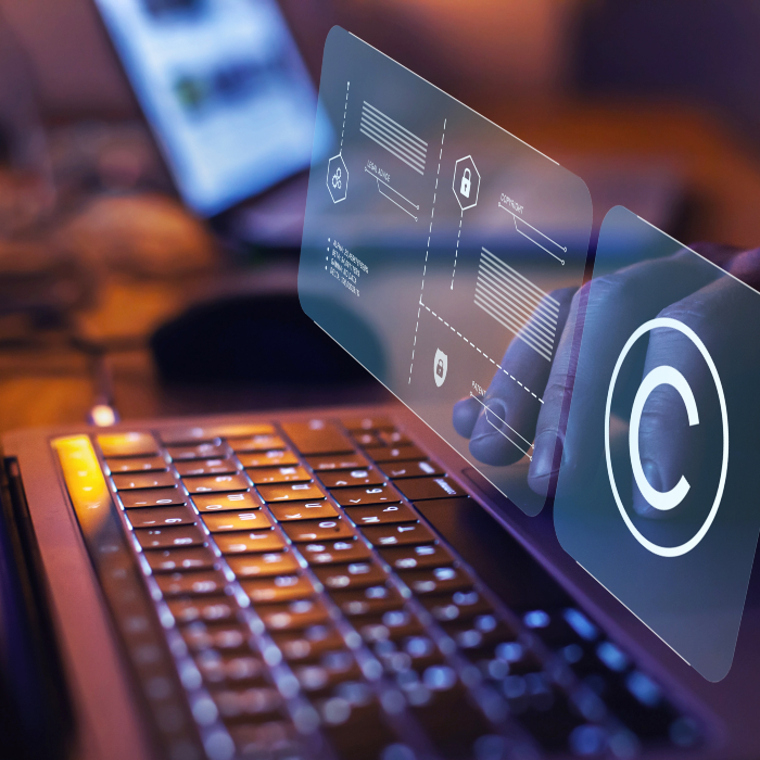 Copyright sign above laptop