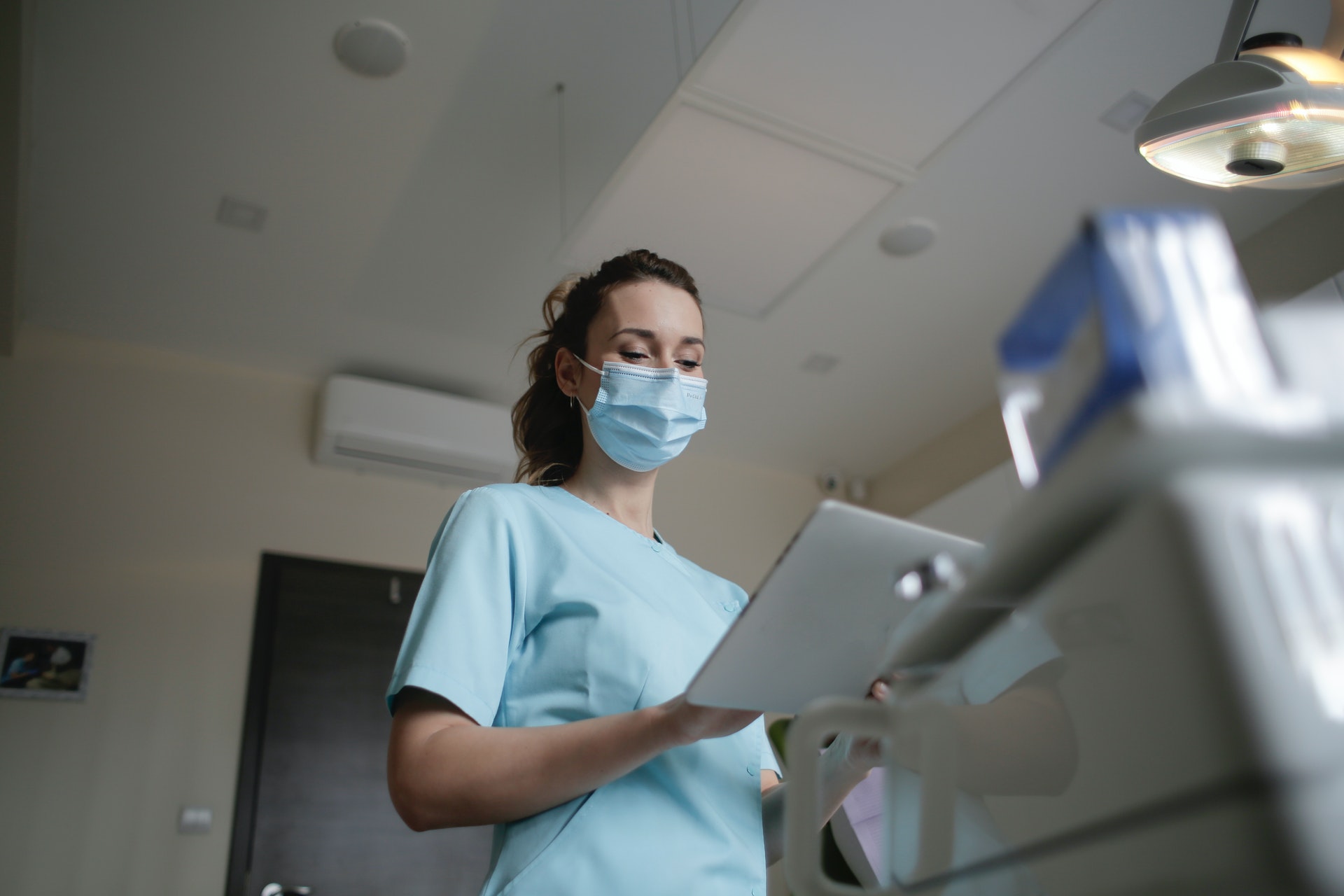 doctor looking at tablet
